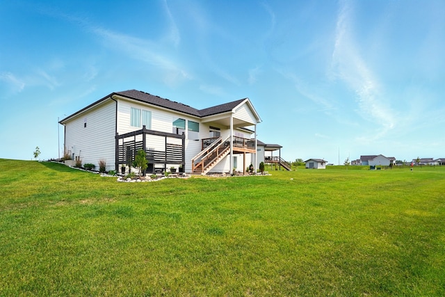 1108 NE Forest Ridge Ct, Ankeny, IA 50021 - back of house featuring stairway, a yard, and a wooden deck