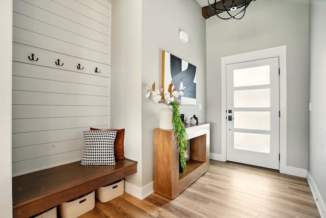 1108 NE Forest Ridge Ct, Ankeny, IA 50021 - mudroom featuring light wood-style floors, a chandelier, and baseboards