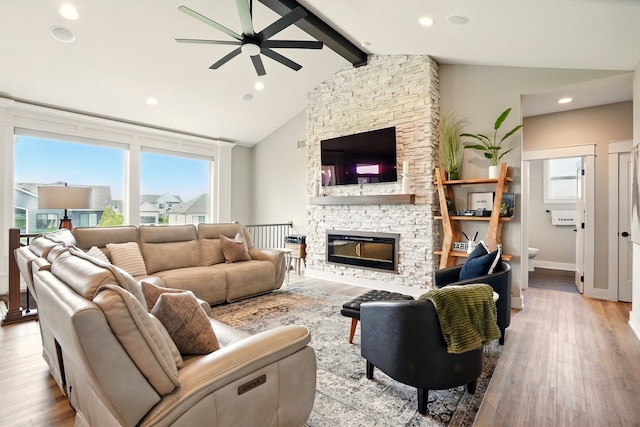 1108 NE Forest Ridge Ct, Ankeny, IA 50021 - living area featuring ceiling fan, plenty of natural light, wood finished floors, a stone fireplace, and recessed lighting