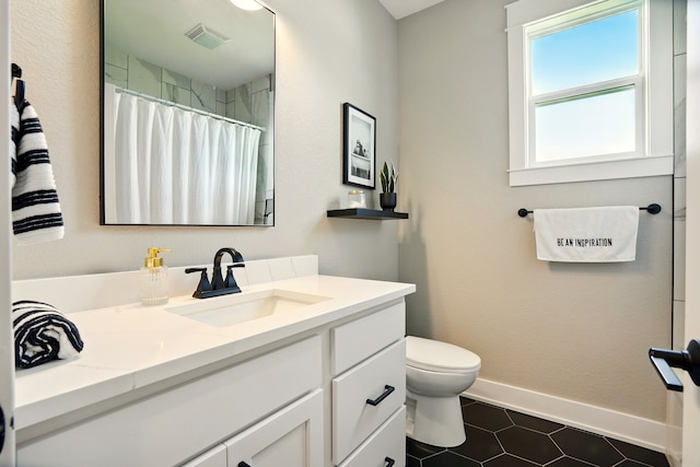 1108 NE Forest Ridge Ct, Ankeny, IA 50021 - full bath featuring vanity, toilet, tile patterned floors, baseboards, and curtained shower