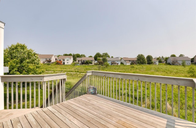 1245 Blue Bonnet Dr, Carlisle, IA 50047 - wooden deck with a residential view and a lawn