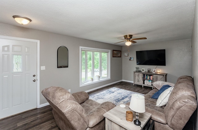 706 S Buxton St, Indianola, IA 50125 - living room featuring ceiling fan, a textured ceiling, dark wood finished floors, and baseboards