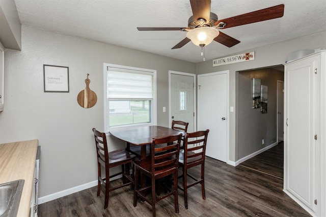 706 S Buxton St, Indianola, IA 50125 - dining room with dark wood-style flooring, ceiling fan, baseboards, and a textured ceiling