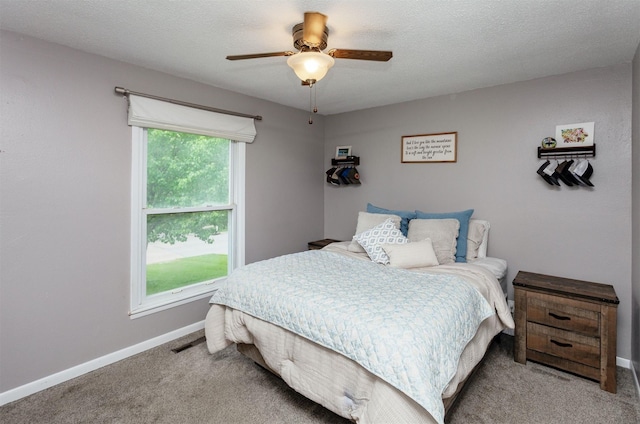 706 S Buxton St, Indianola, IA 50125 - bedroom featuring light carpet, baseboards, and a ceiling fan