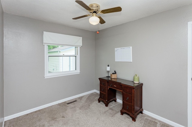 706 S Buxton St, Indianola, IA 50125 - home office featuring ceiling fan, light carpet, and baseboards
