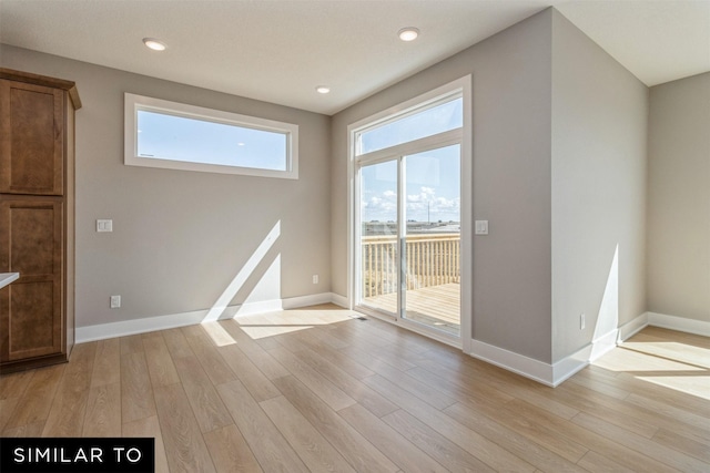 4212 NE 5th St, Ankeny, IA 50021 - empty room with light wood-type flooring, baseboards, and recessed lighting