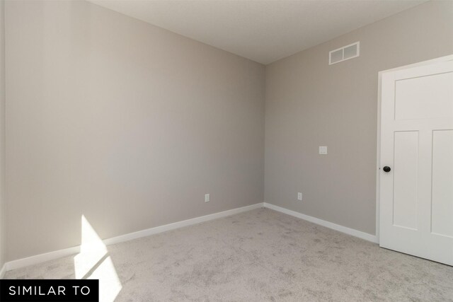 4212 NE 5th St, Ankeny, IA 50021 - empty room featuring carpet floors and baseboards