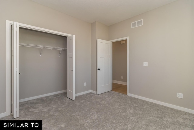 4212 NE 5th St, Ankeny, IA 50021 - unfurnished bedroom with carpet flooring, a closet, and baseboards