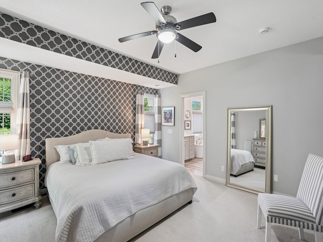 15075 Sheridan Ave, Clive, IA 50325 - bedroom featuring an accent wall, multiple windows, baseboards, light colored carpet, and wallpapered walls