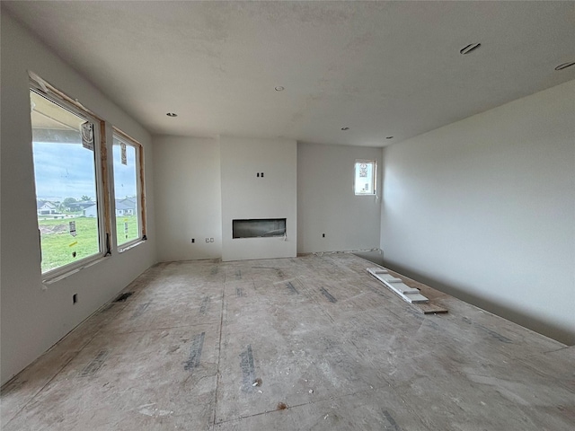 1809 Silver Maple Dr, Norwalk, IA 50211 - unfurnished living room with a glass covered fireplace