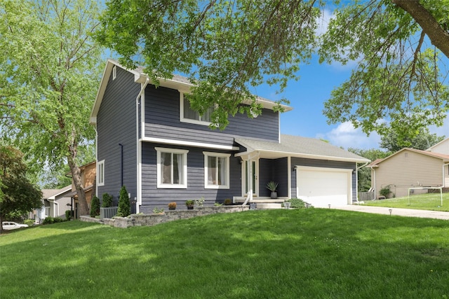 2501 SE 18th Ct, Des Moines, IA 50320 - view of front facade featuring an attached garage, a front yard, and concrete driveway