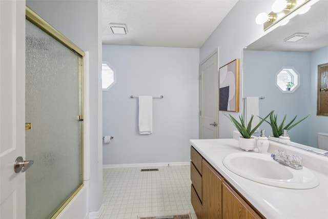2501 SE 18th Ct, Des Moines, IA 50320 - bathroom with vanity, tile patterned floors, plenty of natural light, and toilet