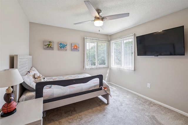 2501 SE 18th Ct, Des Moines, IA 50320 - carpeted bedroom with a textured ceiling, baseboards, and ceiling fan