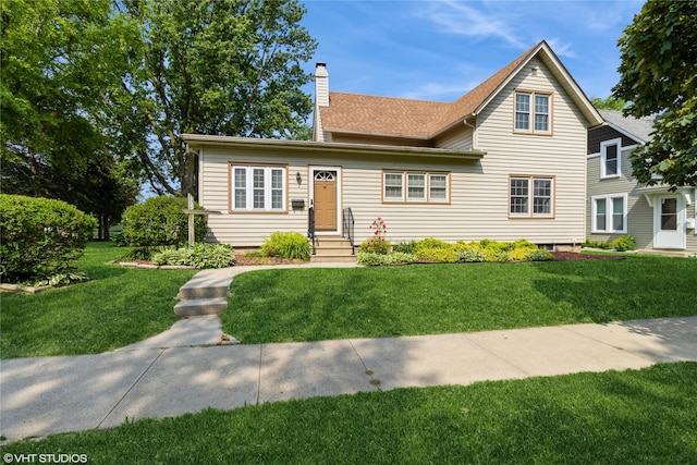 1723 6th St, Perry, IA 50220 - view of front of house featuring a chimney, a front yard, and a shingled roof