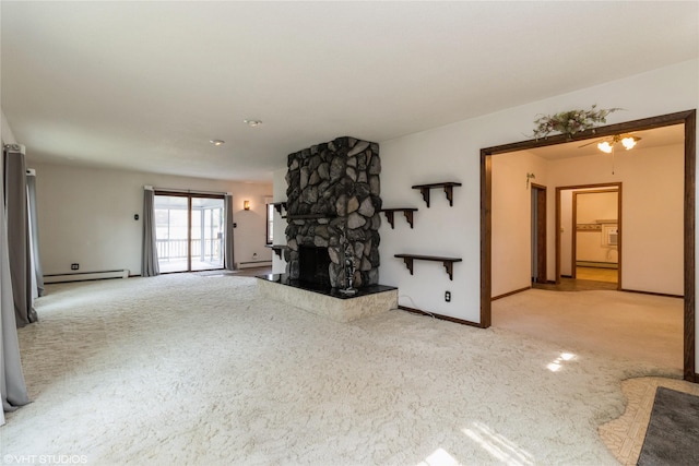 1723 6th St, Perry, IA 50220 - unfurnished living room with a baseboard heating unit, carpet floors, a fireplace, and baseboards