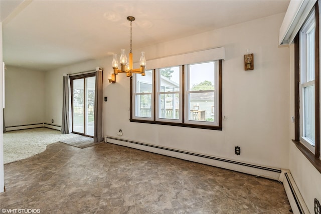 1723 6th St, Perry, IA 50220 - unfurnished dining area with plenty of natural light, baseboard heating, and a chandelier