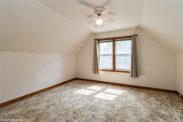 1723 6th St, Perry, IA 50220 - additional living space with carpet floors, vaulted ceiling, a ceiling fan, and baseboards