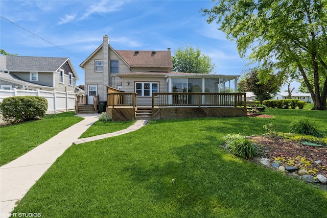 1723 6th St, Perry, IA 50220 - back of property featuring a deck and a shingled roof
