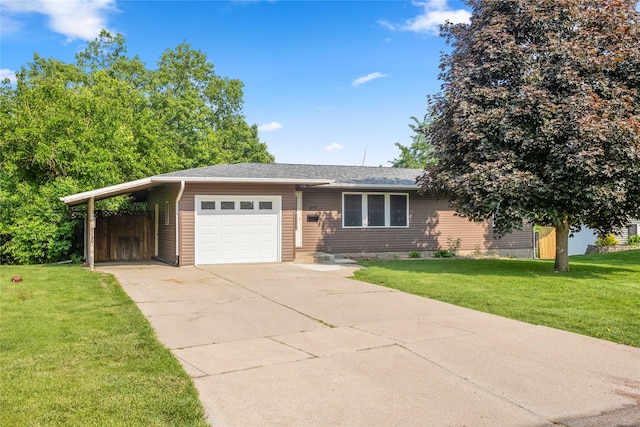 817 Roberts Ter, Marshalltown, IA 50158 - view of front of home with driveway, a front lawn, and a garage