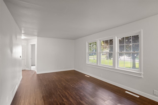817 Roberts Ter, Marshalltown, IA 50158 - unfurnished room with dark wood-style floors and baseboards