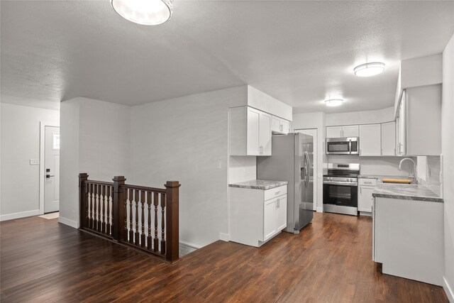 817 Roberts Ter, Marshalltown, IA 50158 - kitchen with stainless steel appliances, a sink, and white cabinets