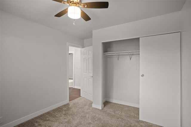 817 Roberts Ter, Marshalltown, IA 50158 - unfurnished bedroom featuring carpet, baseboards, a closet, and ceiling fan