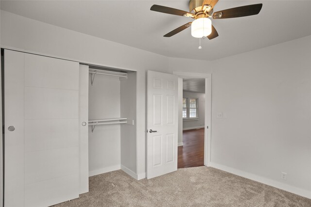 817 Roberts Ter, Marshalltown, IA 50158 - unfurnished bedroom featuring carpet, a closet, baseboards, and a ceiling fan