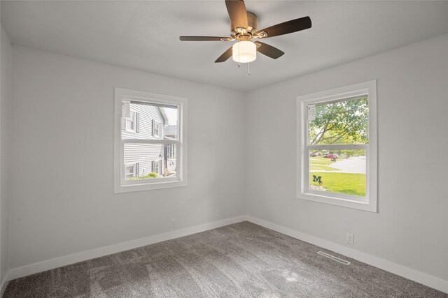 817 Roberts Ter, Marshalltown, IA 50158 - carpeted empty room featuring baseboards and ceiling fan