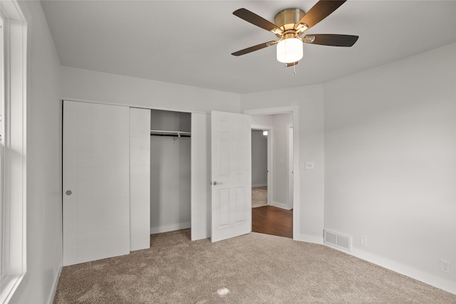 817 Roberts Ter, Marshalltown, IA 50158 - unfurnished bedroom featuring carpet, a closet, baseboards, and ceiling fan