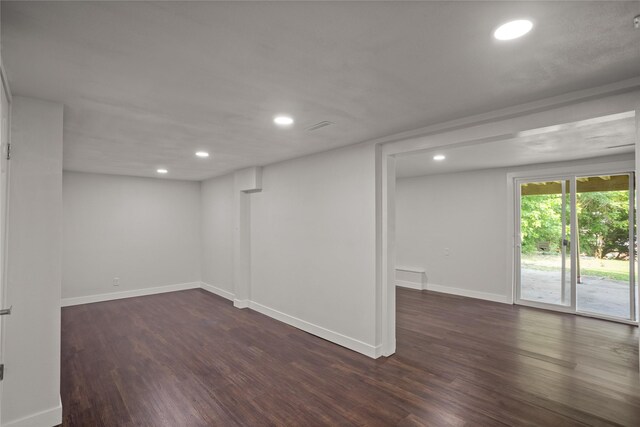 817 Roberts Ter, Marshalltown, IA 50158 - below grade area featuring dark wood-type flooring, recessed lighting, and baseboards