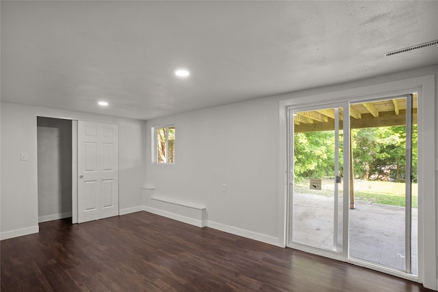817 Roberts Ter, Marshalltown, IA 50158 - empty room with dark wood finished floors, baseboards, and recessed lighting