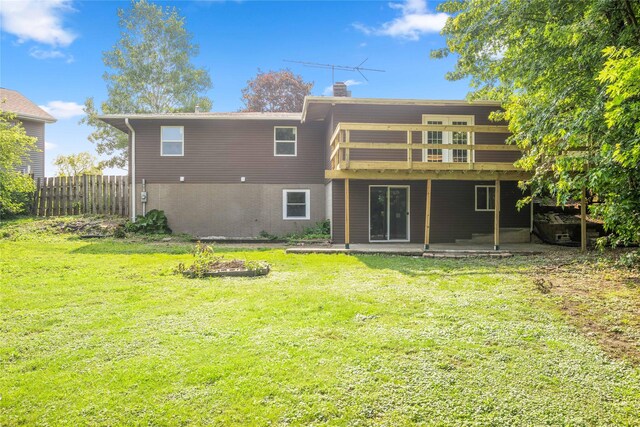 817 Roberts Ter, Marshalltown, IA 50158 - rear view of property with a chimney, a patio area, a deck, and brick siding