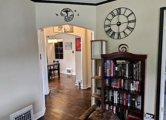 1073 66th St, Windsor Heights, IA 50324 - hallway featuring arched walkways and wood finished floors