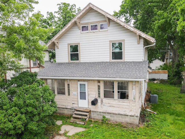 3417 6th Ave, Des Moines, IA 50313 - traditional style home featuring entry steps, a shingled roof, central AC unit, and a front yard