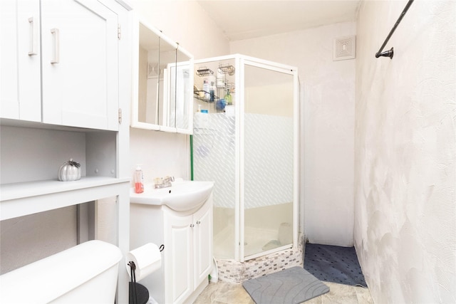 3417 6th Ave, Des Moines, IA 50313 - full bath featuring vanity, a shower stall, and toilet