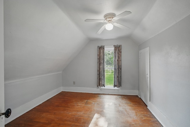 417 NE 2nd St, Panora, IA 50216 - additional living space featuring lofted ceiling, hardwood / wood-style floors, a ceiling fan, and baseboards