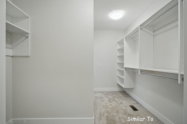1801 Summit Cir NE, Bondurant, IA 50035 - spacious closet featuring light colored carpet