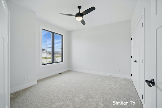 1801 Summit Cir NE, Bondurant, IA 50035 - unfurnished bedroom with carpet, baseboards, and a ceiling fan
