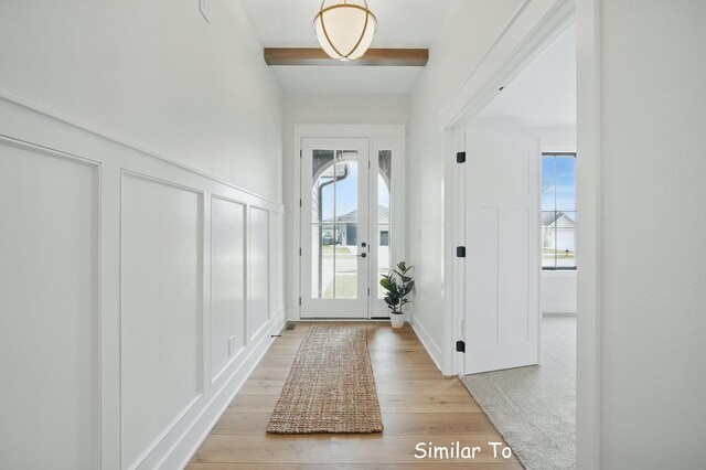 1801 Summit Cir NE, Bondurant, IA 50035 - foyer with a decorative wall, beamed ceiling, light wood-style flooring, and wainscoting