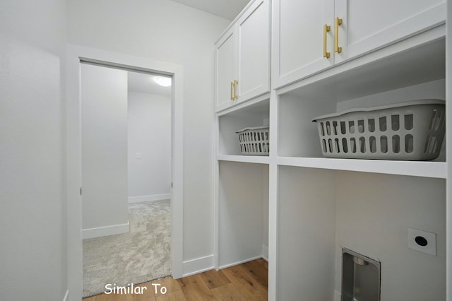 1801 Summit Cir NE, Bondurant, IA 50035 - washroom with light wood-style floors, hookup for an electric dryer, baseboards, and cabinet space