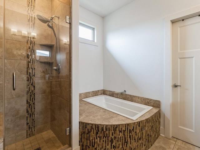 4485 NW 167th St, Clive, IA 50325 - bathroom featuring a bath, a shower stall, and tile patterned flooring