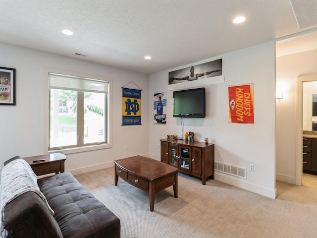 4485 NW 167th St, Clive, IA 50325 - living room featuring light carpet, recessed lighting, baseboards, and a textured ceiling