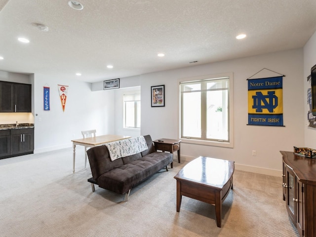 4485 NW 167th St, Clive, IA 50325 - living room featuring light carpet, recessed lighting, baseboards, and a textured ceiling