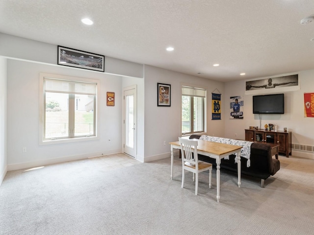 4485 NW 167th St, Clive, IA 50325 - dining room with light colored carpet, recessed lighting, baseboards, and a textured ceiling