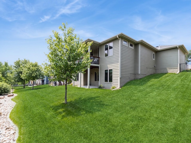 4485 NW 167th St, Clive, IA 50325 - back of house featuring a yard, a patio area, and a balcony