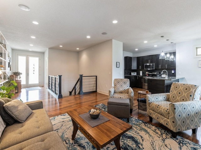 4485 NW 167th St, Clive, IA 50325 - living area featuring recessed lighting, light wood-style flooring, and baseboards