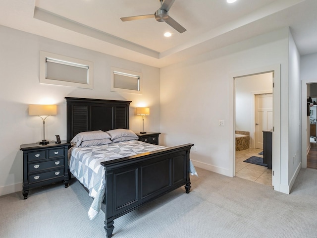 4485 NW 167th St, Clive, IA 50325 - bedroom featuring light colored carpet, baseboards, a raised ceiling, recessed lighting, and connected bathroom
