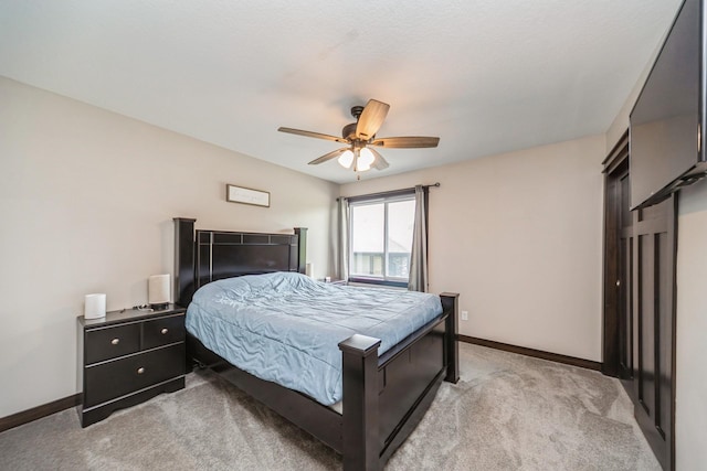 2502 Eagle Ridge Dr, Granger, IA 50109 - bedroom with light carpet, baseboards, and a ceiling fan