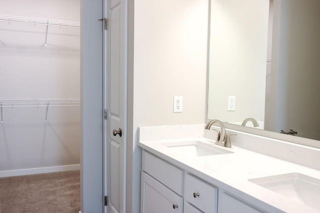 5515 167th St, Urbandale, IA 50323 - full bathroom featuring double vanity and a walk in closet