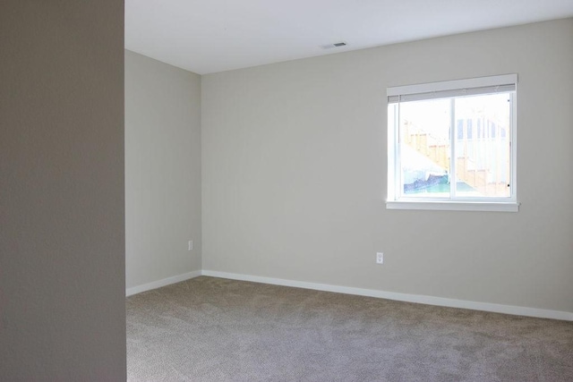 5515 167th St, Urbandale, IA 50323 - unfurnished room featuring carpet floors and baseboards
